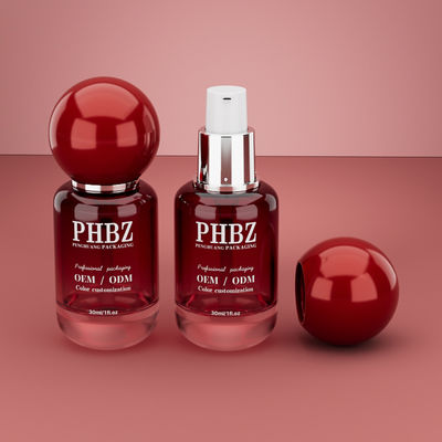 30 мл / 1 унция пустая красная склонная стеклянная бутылка косметической сыворотки с круглой шаровой крышкой, индивидуальный цвет OEM ODM упаковка для ухода за кожей для эфирного масла лосьона